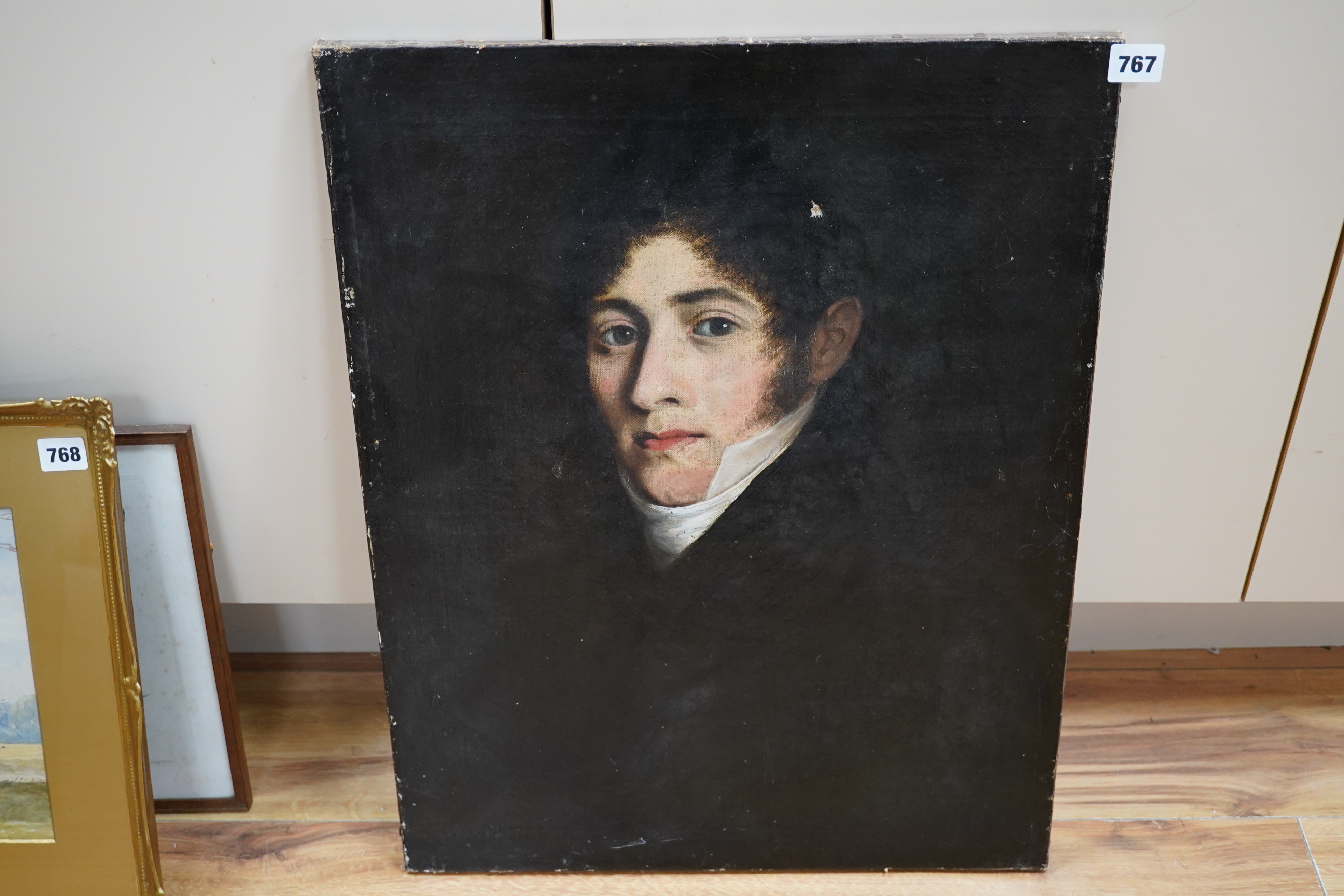 19th century English School, oil on canvas, Head and shoulders portrait of a gentleman wearing a cravat, unsigned, 61 x 47cm, unframed. Condition - fair